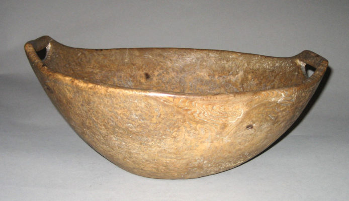 Side view of wooden bowl with two handles