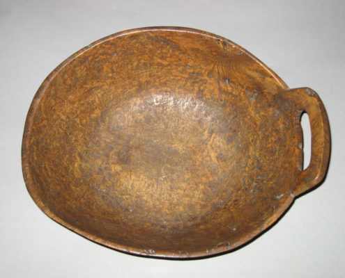 top view of wooden bowl with one handle