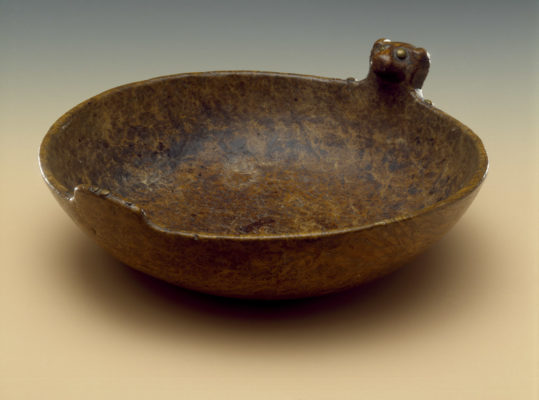 Carved Wooden bowl with a carved bear head on the rim