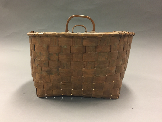 Side view of large basket with handles
